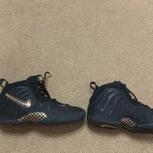 Black and gold Nike Foamposite Pros